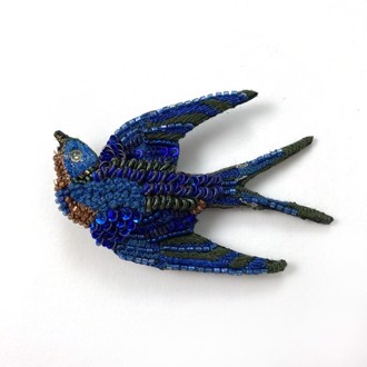 Singing Swallow broche fra Trovelore